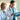 Two doctors in lab coats looking at a tablet with a medical interface.